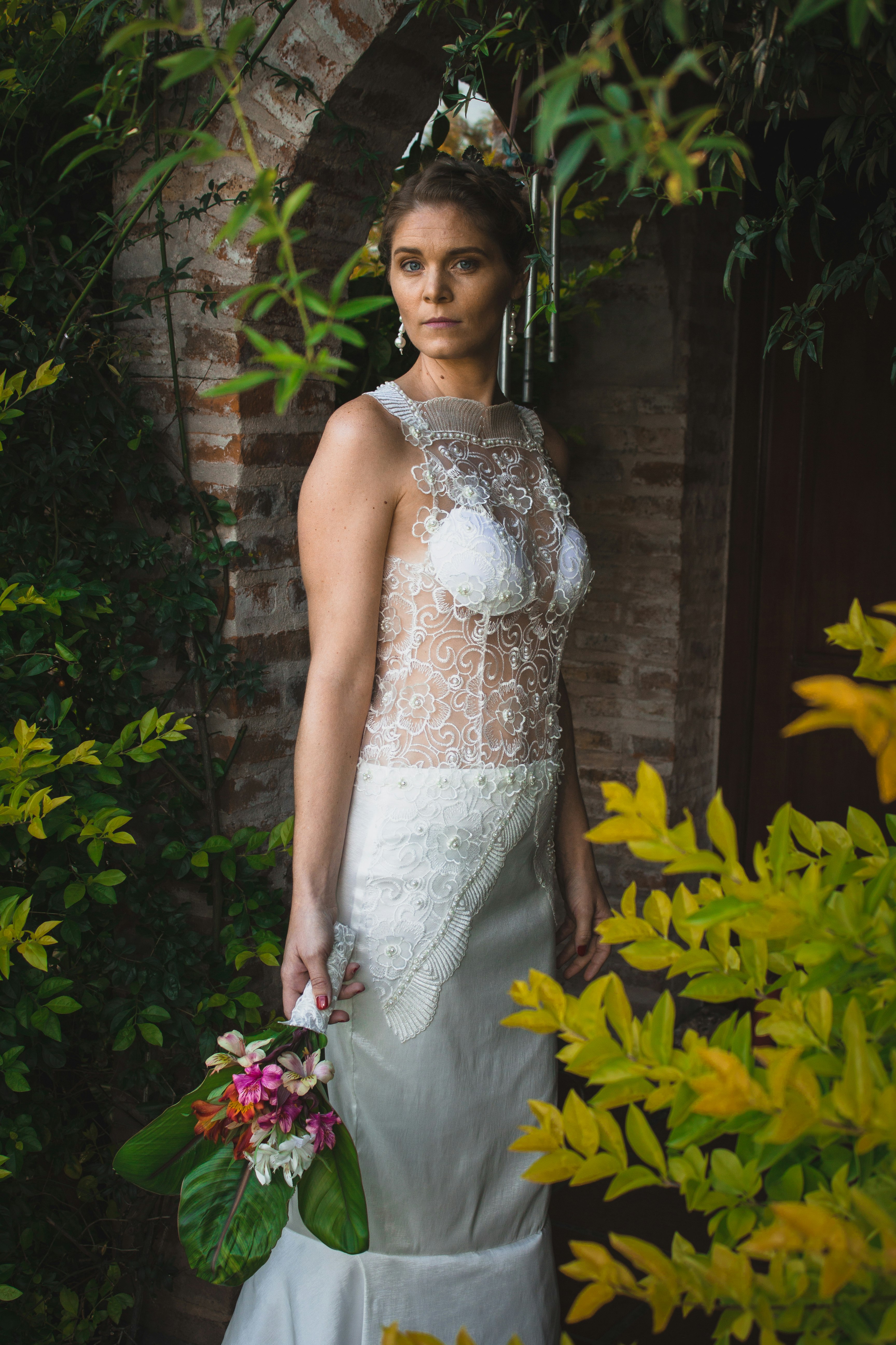 woman standing beside flower